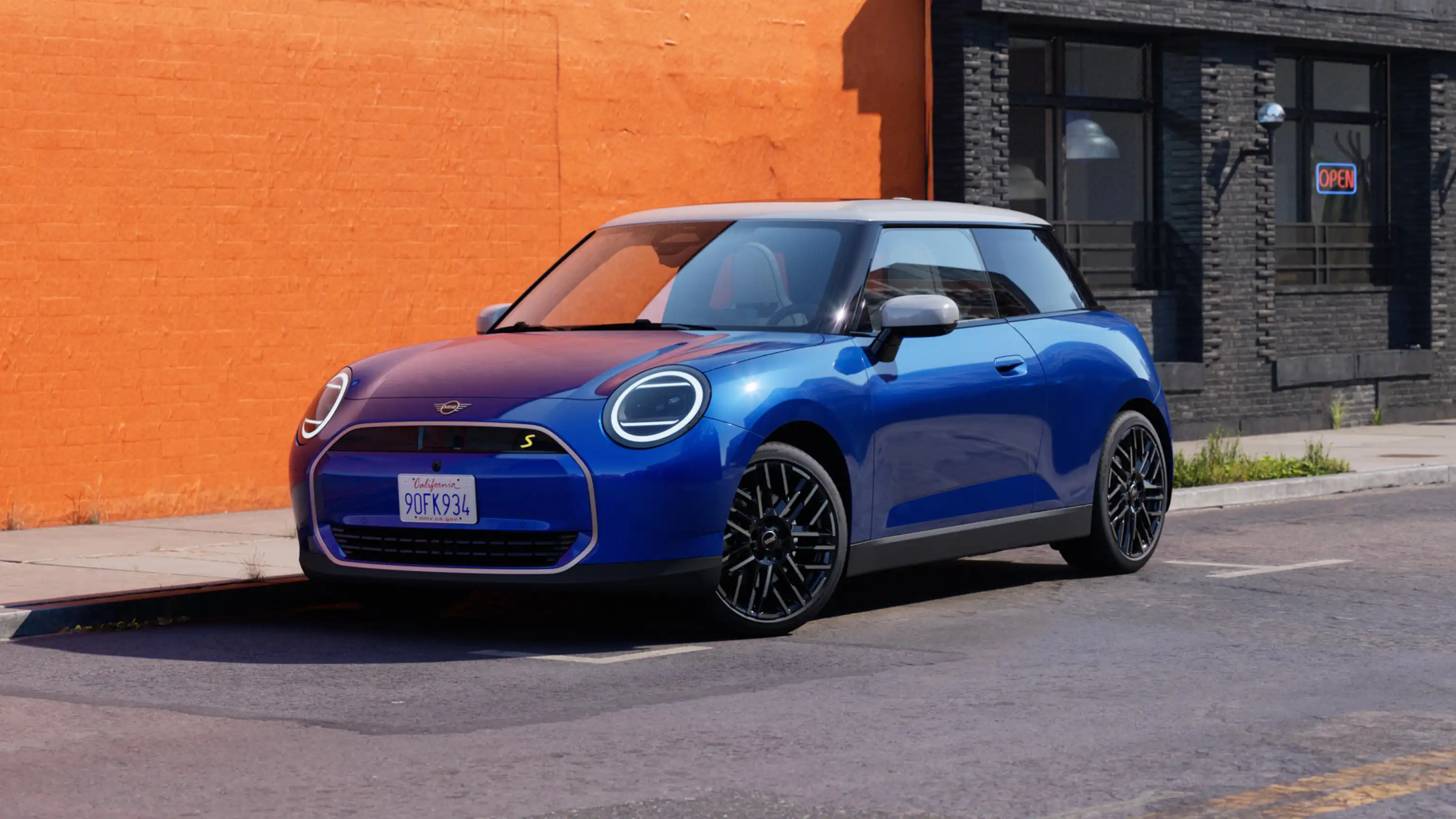 Video showcasing the interior and exterior of an all-electric MINI Cooper in detail. The camera pans over the dashboard, highlighting design elements