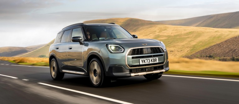 MINI Countryman driving on road in the countryside