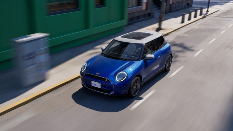 All-Electric MINI Cooper driving down the street